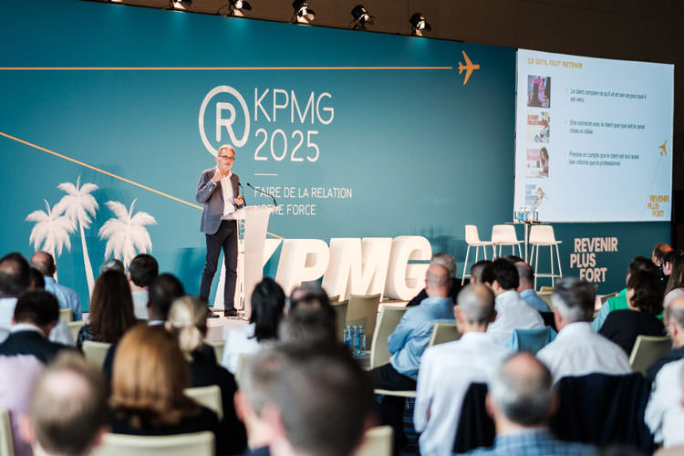 A man speaking at a KPMG conference in Barcelona