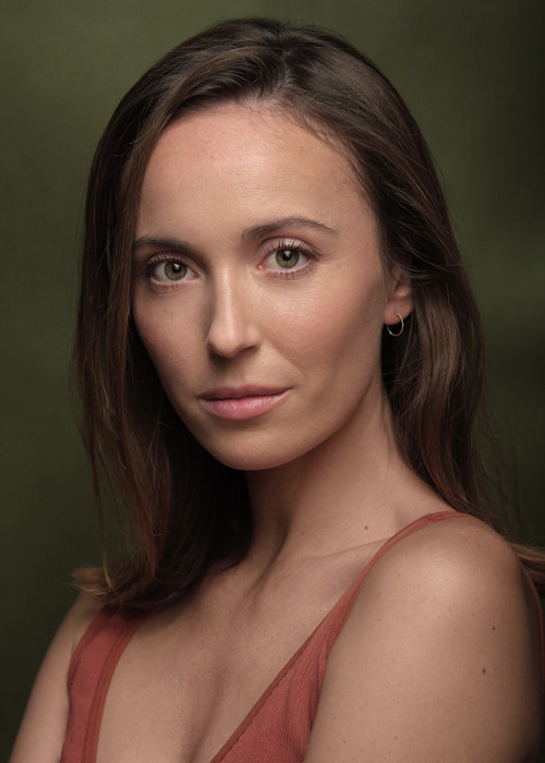 A professional studio headshot of actress Sarah Perriez