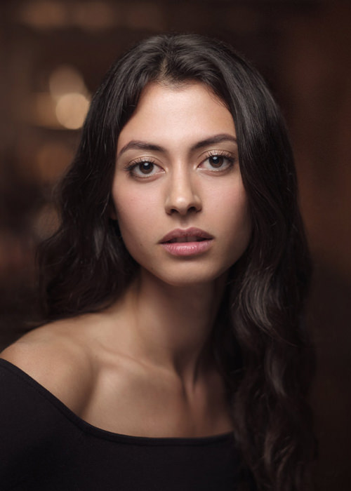 A professional headshot of actress Irene Aguilar