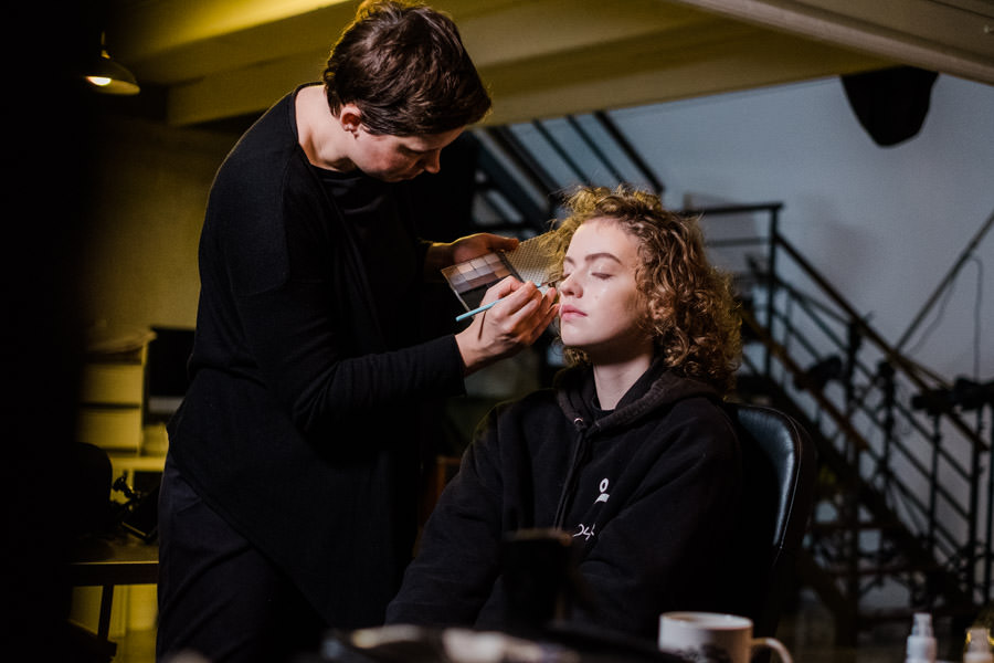 A professional makeup artist behind the scenes